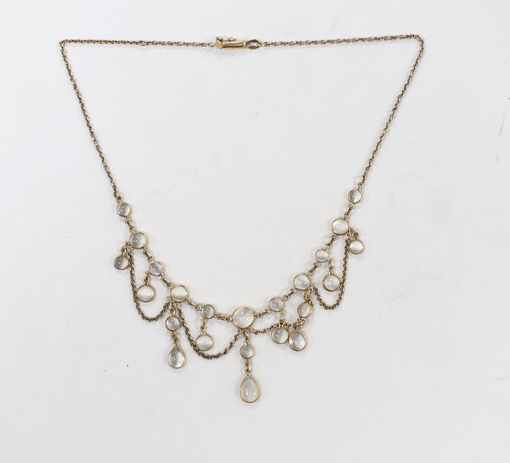 A modern Edwardian style 9ct gold and moonstone cluster set drop fringe necklace, 42cm, gross weight 12.5 grams.